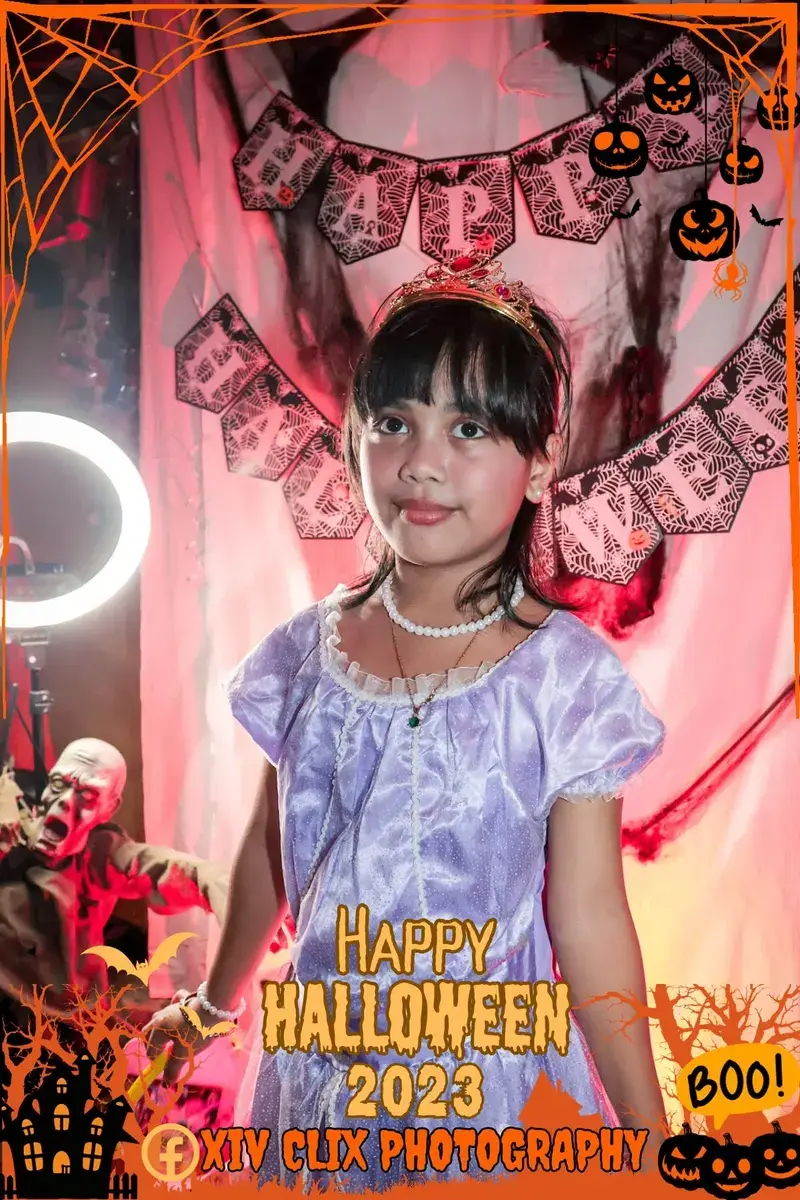 Young girl in a lilac princess costume at a Halloween photo booth